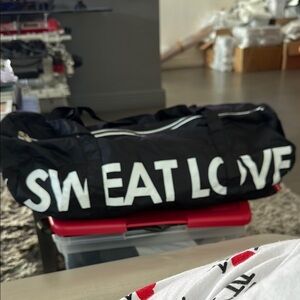 Black Duffel Bag with White Lettering